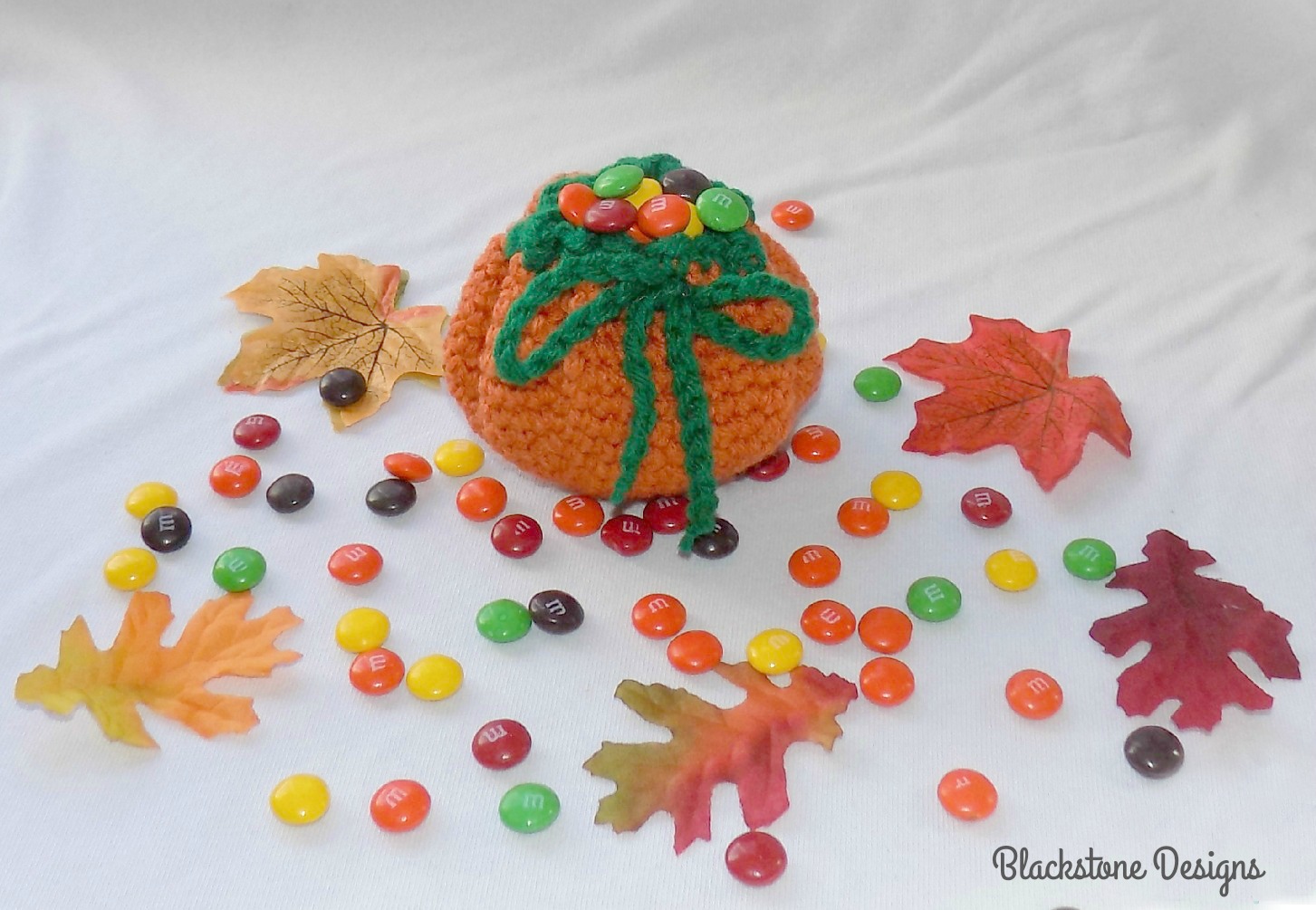 Crochet Pumpkin Treat Sack filled with m&ms
