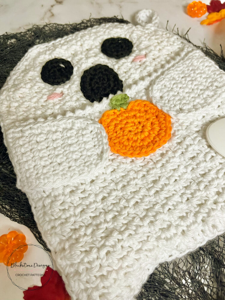 Crochet Ghost Pot Holder with Pocket, Ghost is holding a pumpkin