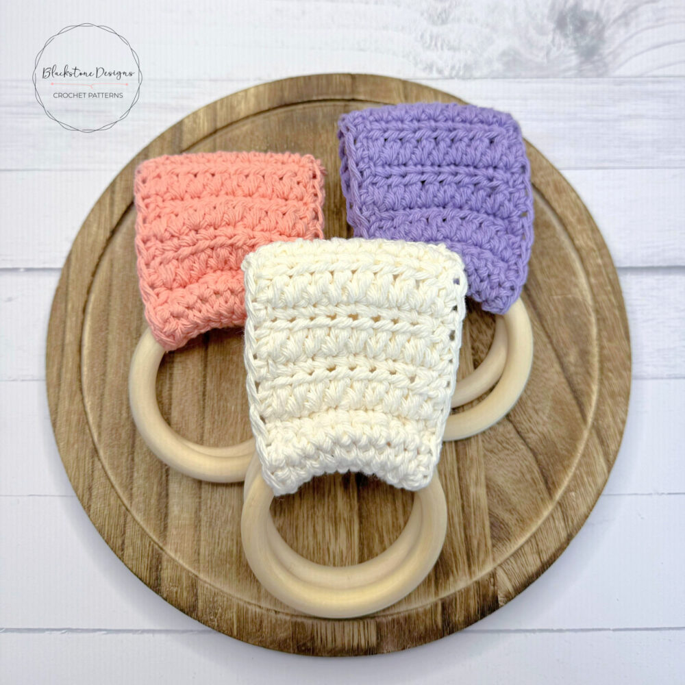 Crochet Towel Hangers made using the Forked Cluster Stitch in Coral, Lavender, and Ivory.