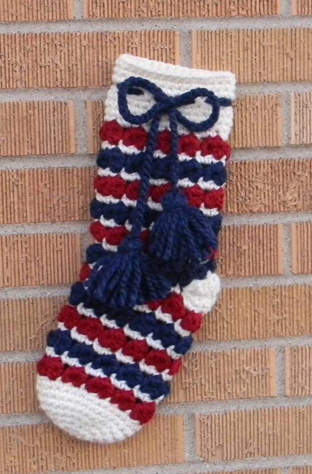 Yuletide Christmas Stocking Crochet Patternshown in red, white, blue