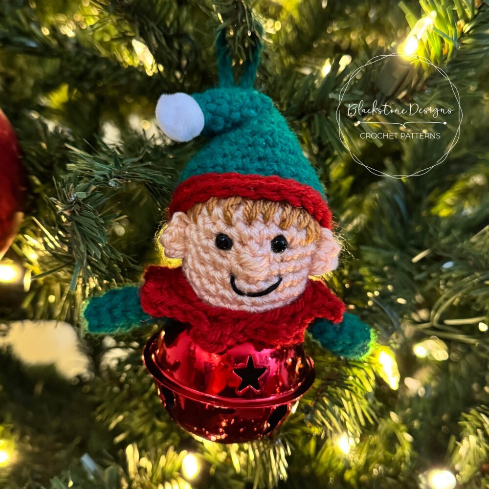 Crochet Elf Jingle Bell Ornament Pattern of Christmas Elf on top of a large jingle bell