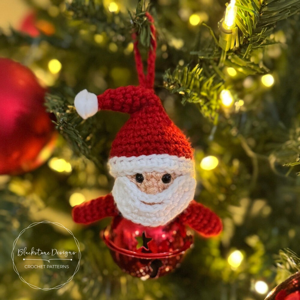 Crochet Santa Jingle Bell Ornament Pattern of Santa Claus on top of a large jingle bell