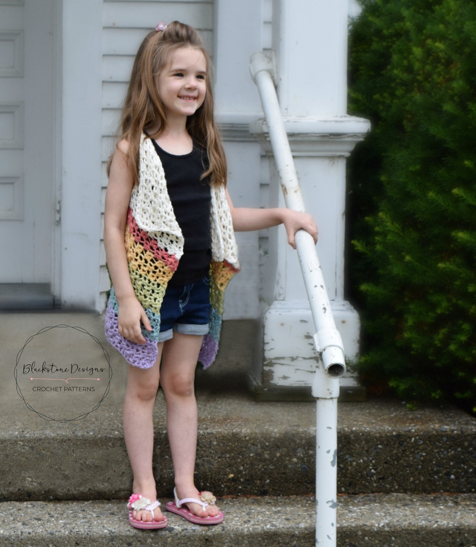 Crochet Cascade Vest Pattern shown with a white top half and rainbow striped bottom half