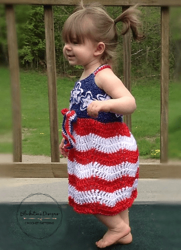 Stars and Stripes Sundress for Babies with a solid blue bodice, red and white striped skirt, white stars on bodice